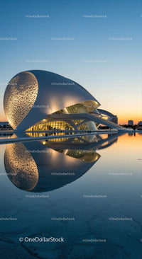 Futuristic Building Illuminated at Sunset with Water Reflection