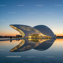 Futuristic White Building Reflected in Twilight Water