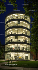 Illuminated Modern Glass Building at Night