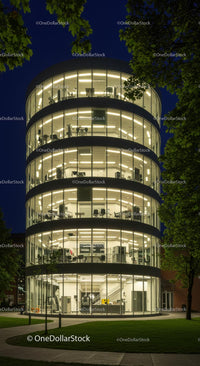 Illuminated Modern Glass Building at Night