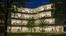 Modern Office Building Illuminated at Night