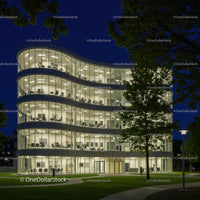 Modern Office Building With Illuminated Glass Facade at Night