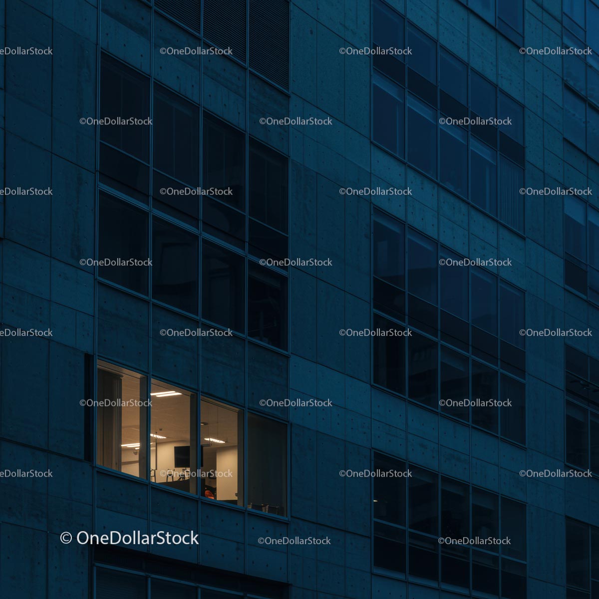 Modern Office Building with Illuminated Windows at Night