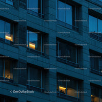 Modern Office Building at Dusk with Illuminated Windows
