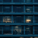 Illuminated Office Windows at Night in Modern Urban Building