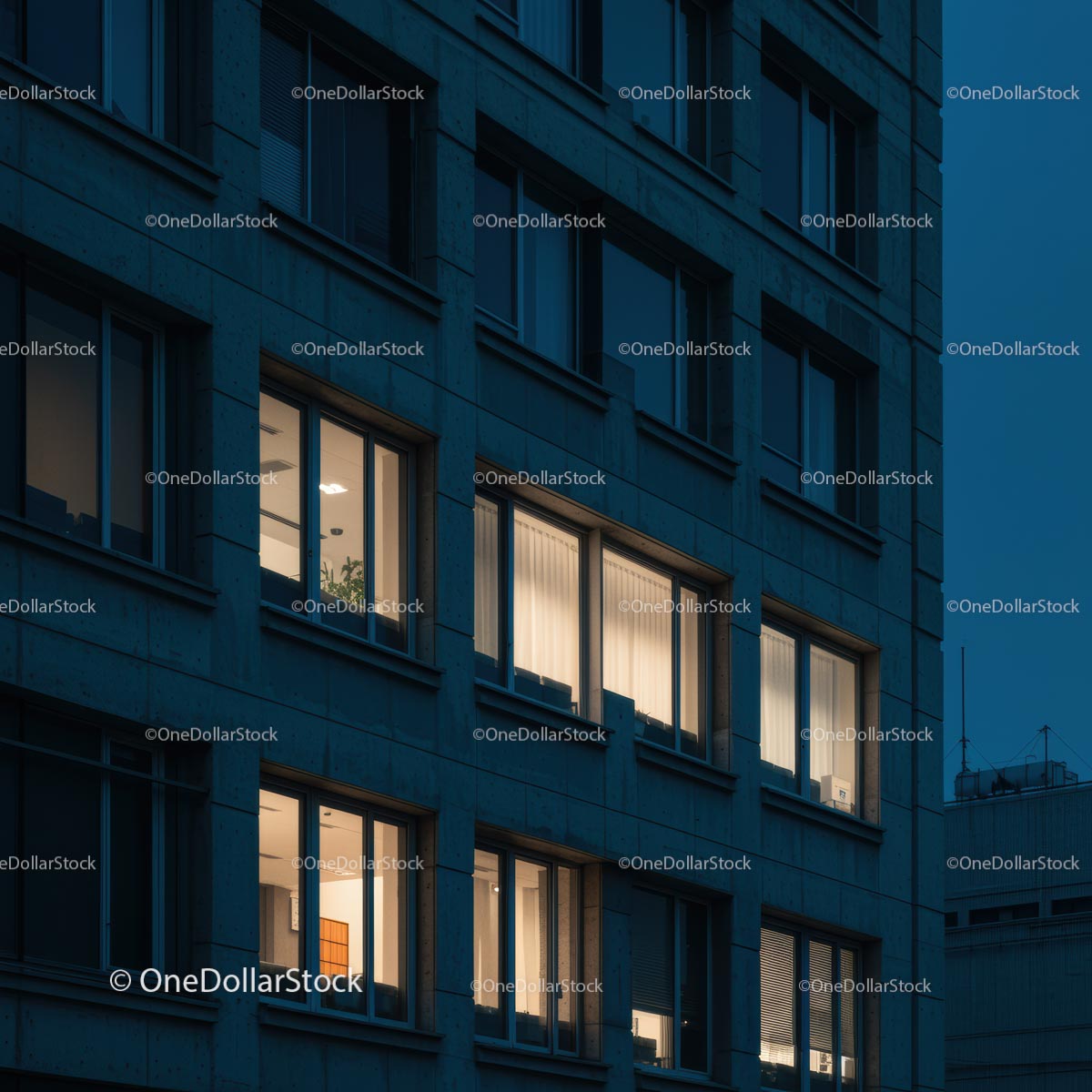 Nighttime City Office Building with Illuminated Windows