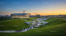 Futuristic Building and Green Landscape at Sunset