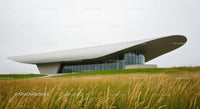 Futuristic Building with Curved Roof in Natural Setting