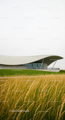 Sleek Modern Building with Flowing Curved Roof