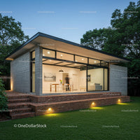 Modern Home with Glass Facade and Lush Garden Setting