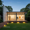 Modern Glass House with Lush Garden at Dusk