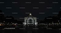 Illuminated Historic Building at Night with Clock Tower