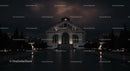 Illuminated Historic Building at Night with Dramatic Sky