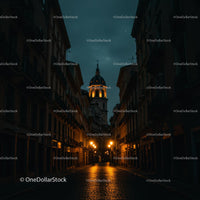 Illuminated Cobblestone Street at Night in Historic City