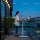 Businesswoman Working on Rooftop with Stunning Cityscape