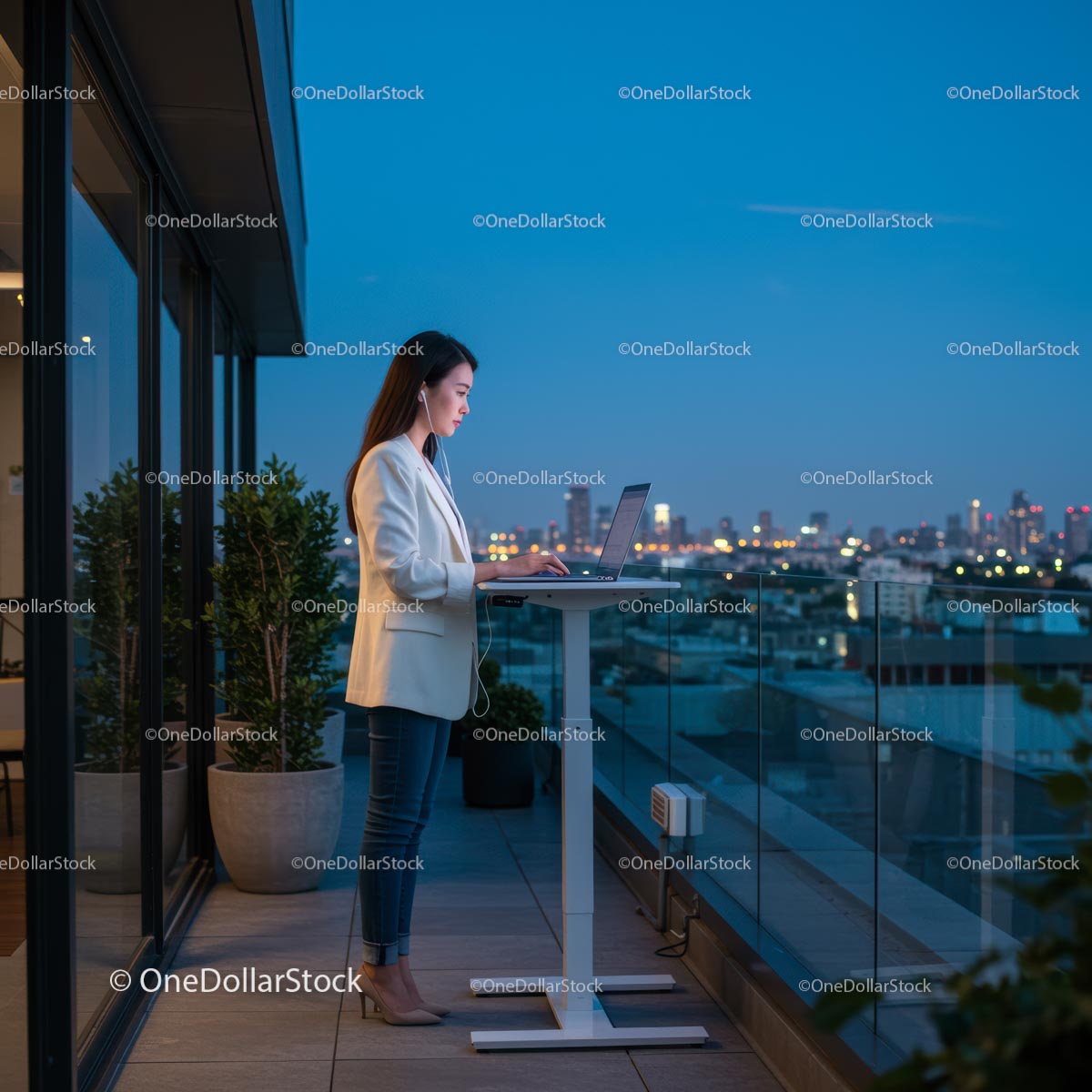 Businesswoman Working on Laptop with City Skyline View