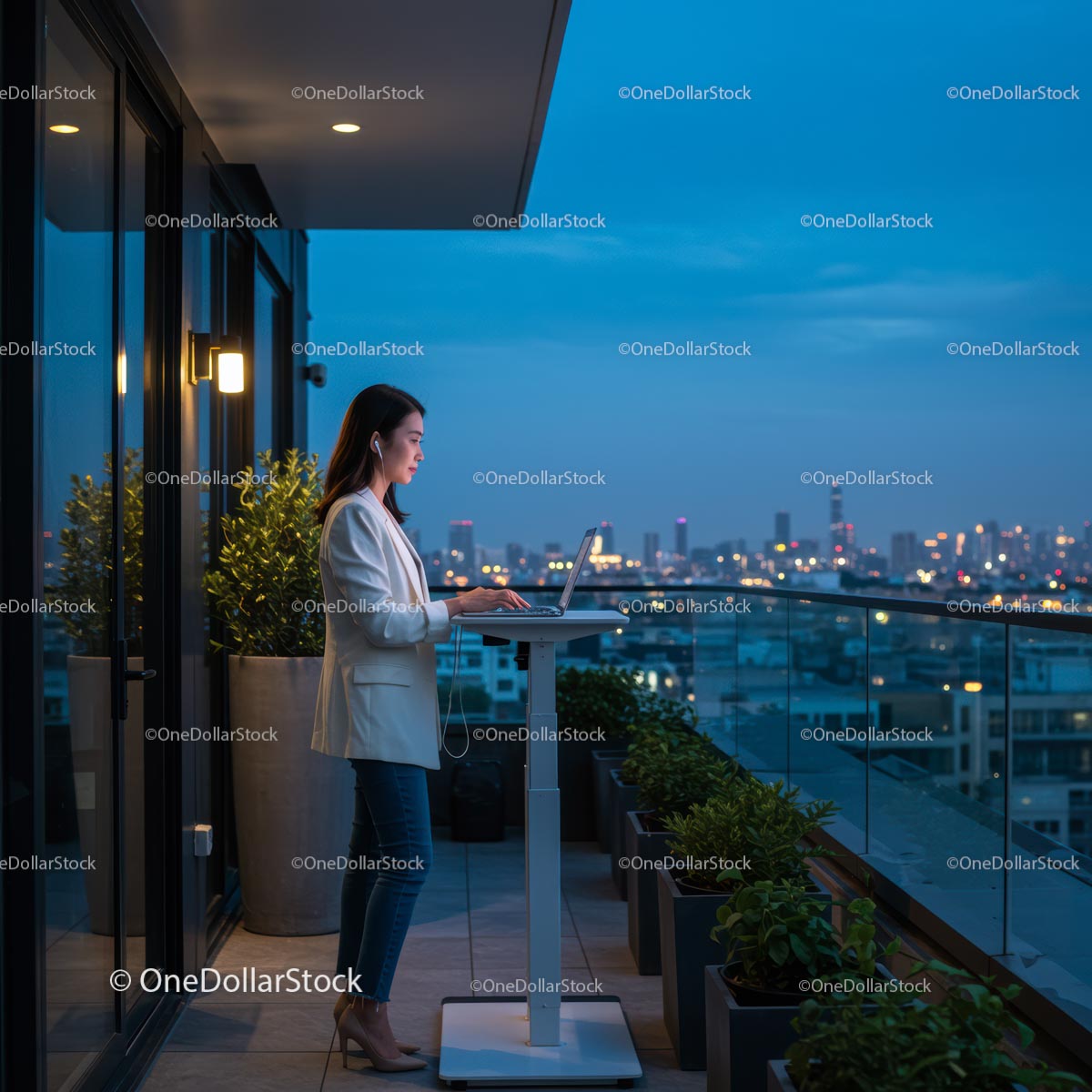 Businesswoman Working on Laptop on Balcony at Dusk