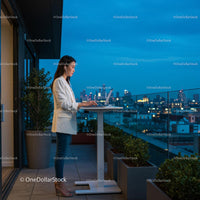 Professional Woman Working on Laptop at Night with City Skyline