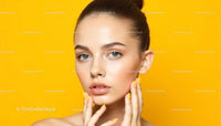 Elegant Woman with Yellow Nails Against Vibrant Yellow Background