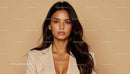 Elegant Woman in Beige Suit with Long Dark Hair