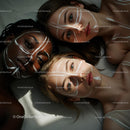 Three Women with Artistic Face Paint and Expressive Eyes