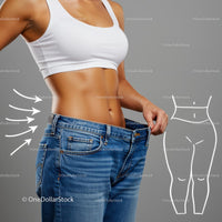 Fit Woman Showcasing Weight Loss with Loose Jeans