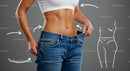 Woman Celebrates Fitness Goal with Loose Jeans