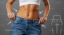 Confident Woman Showing Weight Loss in Blue Jeans