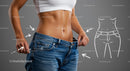 Fit Woman Showcasing Weight Loss in Loose Jeans