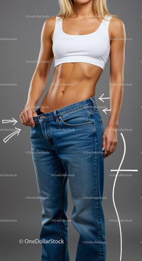Fit Woman in Loose Jeans Showcasing Weight Loss Success