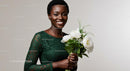 Smiling Woman in Green Dress Holding White Peonies Bouquet