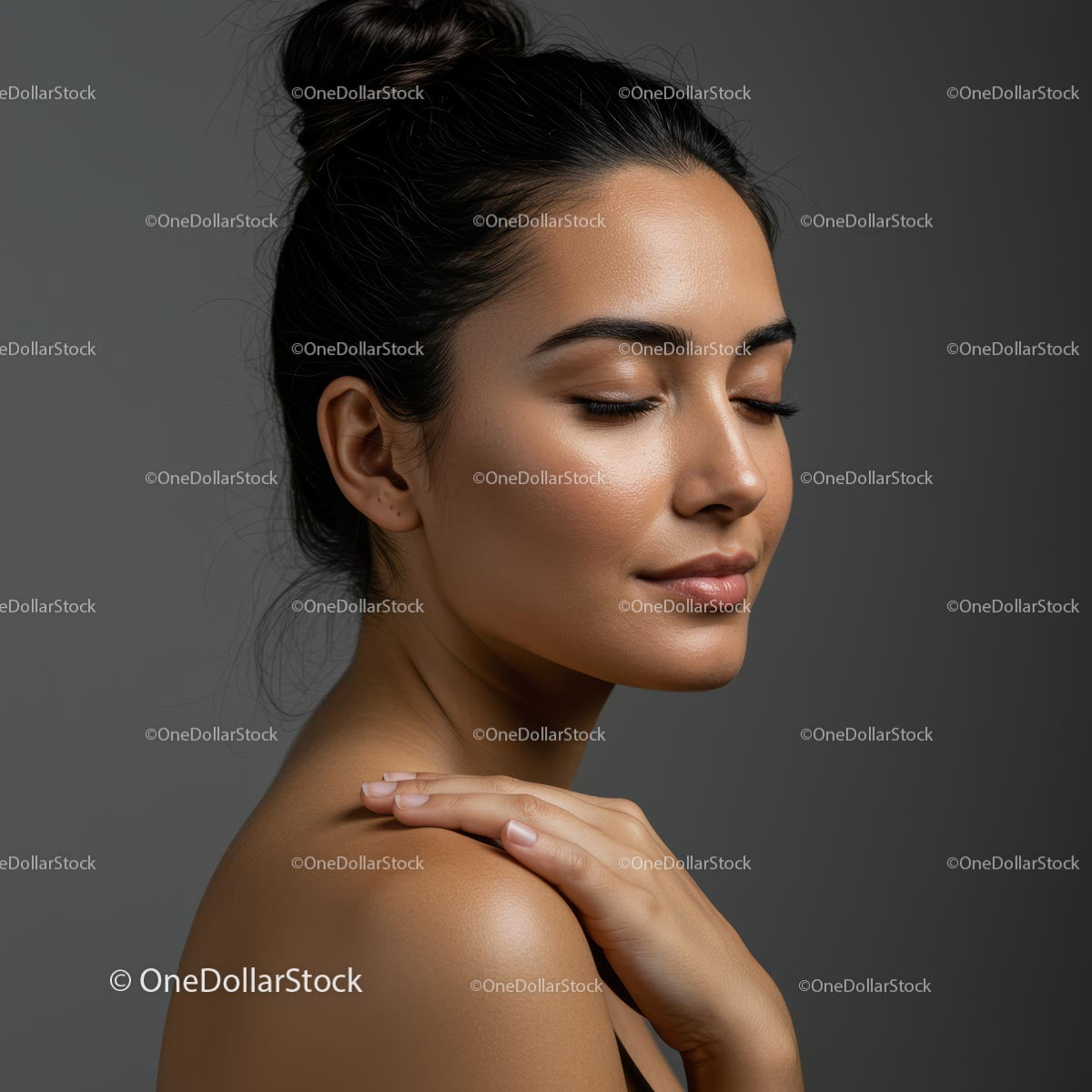 Serene Woman with Closed Eyes and Elegant Bun
