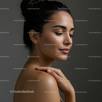 Serene Woman in Soft Lighting with Gentle Touch
