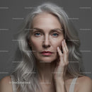 Mature Woman with Silver Hair and Thoughtful Expression