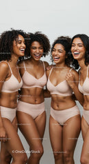 Joyful Women Laughing Together in Casual Outfits
