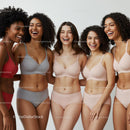 Diverse Group of Women Smiling in Comfortable Lingerie