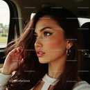 Natural Beauty with Thoughtful Expression in Car
