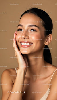 Smiling Woman with Radiant Skin on Brown Background