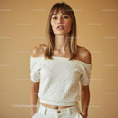 Confident Woman in White Off-Shoulder Sweater
