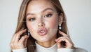 Elegant Woman with Glamorous Earrings in Close-Up