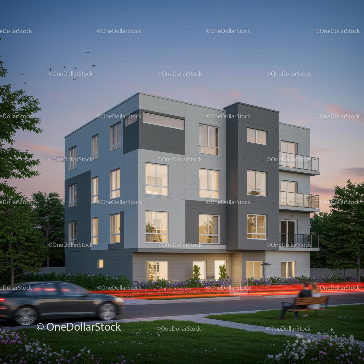 Nowoczesny budynek apartamentowy o zachodzie słońca z bujną zielenią