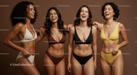Four Women in Colorful Bikinis Laughing Together