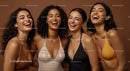 Group of Joyful Women Laughing in Colorful Swimwear