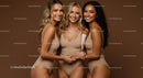 Three Smiling Women in Beige Swimsuits Embracing Friendship