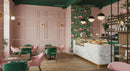 Stylish Modern Cafe with Flamingo Wallpaper and Pastry Display