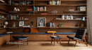 Contemporary Reading Nook with Wooden Shelves and Leather Chairs