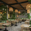 Tropical Restaurant with Lush Greenery and Rattan Decor