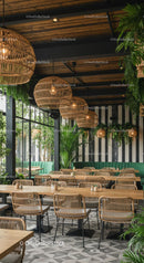 Chic Cafe Interior with Lush Greenery and Wicker Lighting