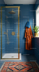 Modern Blue Tile Bathroom with Gold Shower and Orange Bathrobe