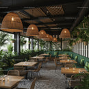 Chic Cafe with Abundant Greenery and Wicker Lighting
